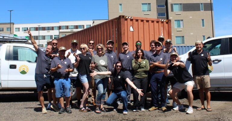 The Thrive Team posing in front of the Denver branch